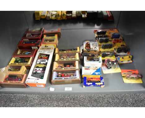 A shelf of 1990's/2000's Matchbox, Corgi and Hot Wheels die-casts, 35 in total, all boxed or on bubble cards