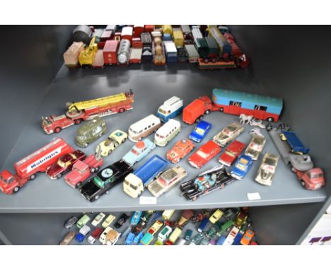 A shelf of Corgi playworn die-casts including Chipperfield Articulated Horse Box with plastic horses, Ariel Rescue Truck, Bla