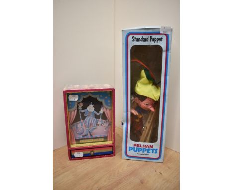 A Pelham Standard Puppet, SL7 Pinocchio in original blue window display box along with a CI Ikecho, Japan, Dancing Clown Musi