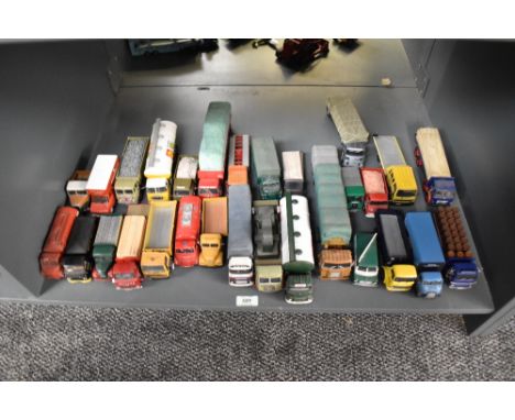 A shelf of Corgi and similar die-casts, Wagons, Articulated Trucks, etc