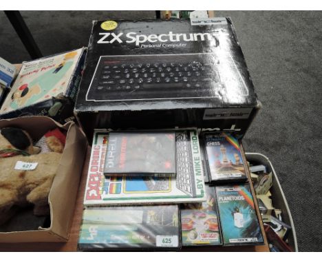 A Sinclair ZX Spectrum Personal Computer in original box along with games including Pinball Wizard, Chess, Planetoids etc