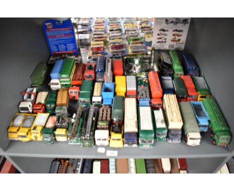 A shelf of Corgi and similar die-casts, Wagons, Articulated Trucks, Accessories etc