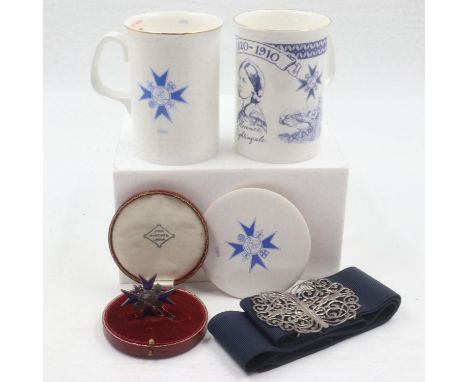 Boxed Florence Nightingale medal, awarded 1956 with related hallmarked silver buckle and commemorative ceramics. UK P&amp;P G