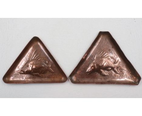Newlyn, two Arts &amp; crafts copper triangular plaques, each with relief decoration of stylised fish, largest 13 x 10cm. UK 
