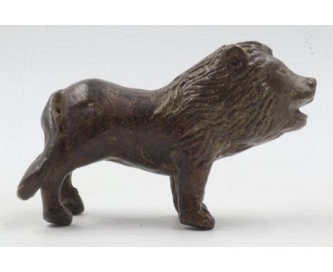 Small 19th century bronze figure of a lion, L: 70mm. UK P&amp;P Group 1 (£16+VAT for the first lot and £2+VAT for subsequent 