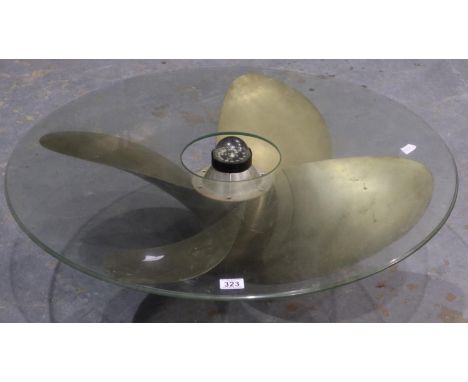 Large bronze four blade propellor coffee table with glass top. Glass diameter is 89cm, propellor diameter is 80cm.