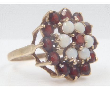9ct gold garnet and opal set target ring, size Q, 4.4g. UK P&amp;P Group 0 (£6+VAT for the first lot and £1+VAT for subsequen