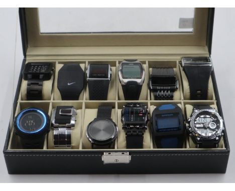 Presentation case of twelve digital gents wristwatches. UK P&amp;P Group 2 (£20+VAT for the first lot and £4+VAT for subseque