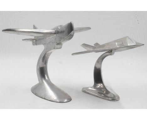 Two cast aluminium aircraft on stands. Largest wingspan L: 28cm. UK P&amp;P Group 2 (£20+VAT for the first lot and £4+VAT for