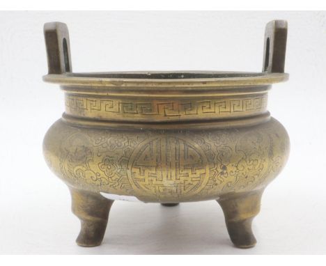 Chinese bronze censer, raised on three supports with engraved decoration and impressed six character mark to base, D: 15 cm. 