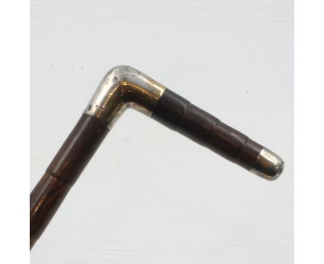 Bamboo walking stick with HMS mounts, maker Briggs. Length 92cms. UK P&amp;P Group 2 (£20 plus VAT for the first lot, £4 plus