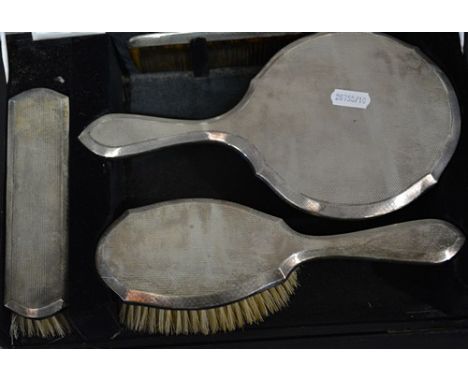 Four piece silver backed dressing table set, Birmingham 1928, engine turned decoration, comprising a mirror, 26cm, hair brush