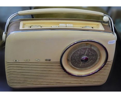 Vintage Bush transistor radio, and a brass jam pan with a steel strap handle, width 33cm.