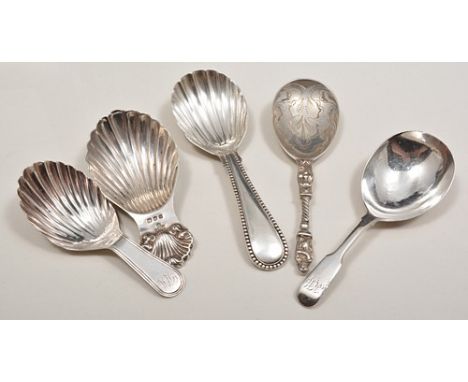 George III silver caddy spoon, London 1810, thread baton, scallop bowl, another George III caddy spoon, London 1807 and three