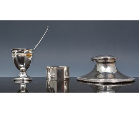 Circular silver Capstan inkwell, London 1916, beaded outlines, diameter 11cm, a silver napkin ring and a cased Christening se