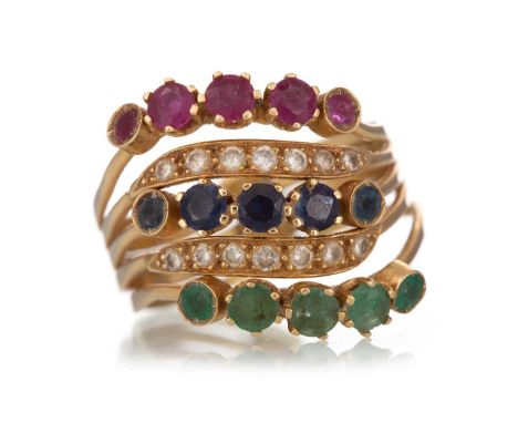 RUBY, EMERALD, SAPPHIRE AND DIAMOND RING with alternating moveable sections, marked 750, size R+Qty: 8gsize R+ as described.