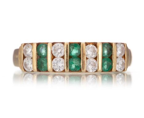 EMERALD AND DIAMOND RING IN EIGHTEEN CARAT GOLD  set with alternating round brilliant cut diamonds and emeralds, in eighteen 