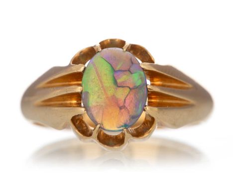 OPAL GYPSY RING set with a cabochon opal, in eighteen carat gold, size OQty: 7g