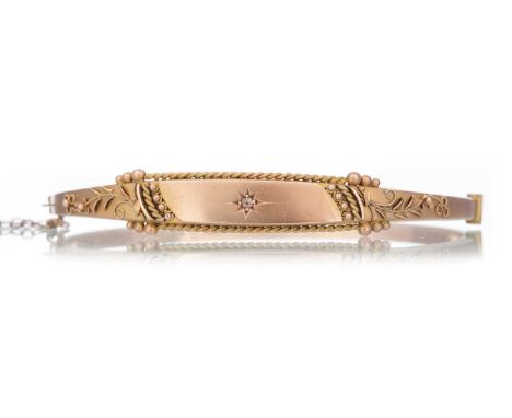 VICTORIAN DIAMOND SET BANGLE set centrally with a small diamond, in nine carat goldQty: 5.9g