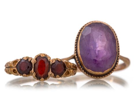 TWO GEM SET RINGS comprising a garnet and an amethyst example, each in nine carat goldQty: 5.5g (2)