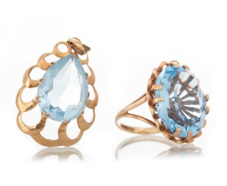 DRESS RING AND PENDANT IN NINE CARAT GOLD   the ring set with a pale blue oval stone, the pendant with a pear shaped stone, e