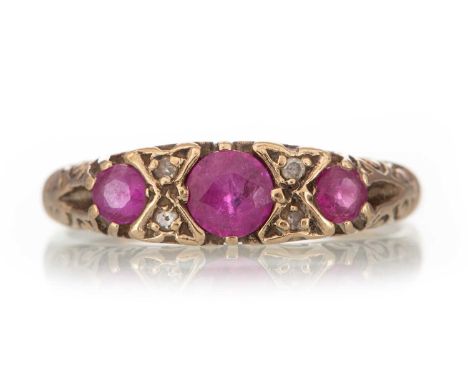 RUBY AND DIAMOND RING set with rubies interspaced by pairs of diamonds, indistinctly marked, size J 1/2Qty: 2g