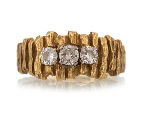 TEXTURED DIAMOND SET DRESS RING  set with three central round brilliant cut diamonds totalling approximately 0.50 carats, in 