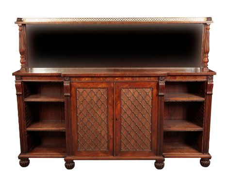 A REGENCY ROSEWOOD BREAKFRONT CHIFFONIER early 19th century, the top section with a single three-quarter galleried shelf over