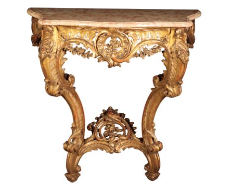 A LOUIS XV STYLE GILTWOOD AND MARBLE TOPPED CONSOLE TABLE 19th century, the serpentine and moulded marble top on a heavily ca
