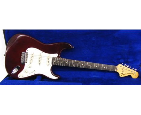 1974 Fender Stratocaster electric guitar, made in USA, ser no 5xxxx2; Finish: wine red with surface scratches to be expected 