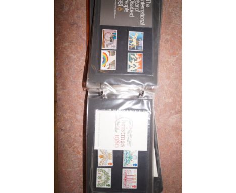 An album containing many mint stamps post 1971