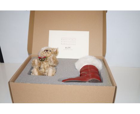 A Steiff teddy bear in a boot with COA