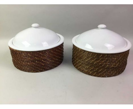 TWO CERAMIC CASSEROLE SERVING DISHES, ALONG WITH A PAN HOLDER AND GLASSES  the serving dishes in bamboo holders
