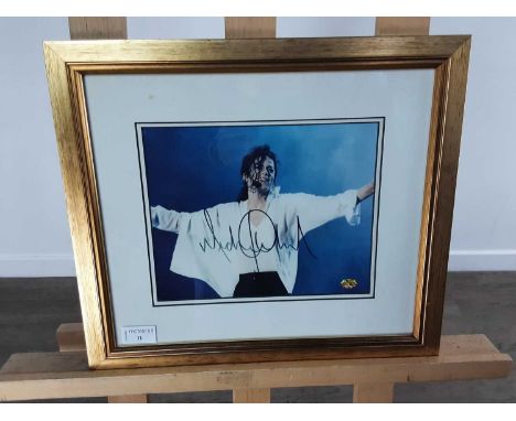 SIGNED MICHAEL JACKSON PHOTOGRAPH, mounted, framed and under glass, certificate verso36cm x 41cmWe are unfortunately unable t