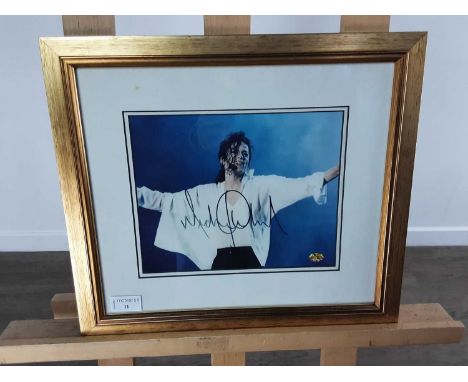 SIGNED MICHAEL JACKSON PHOTOGRAPH, mounted, framed and under glass, certificate verso36cm x 41cmWe are unfortunately unable t