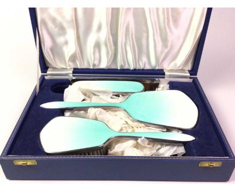 WHITE METAL AND GUILLOCHE ENAMEL FOUR-PIECE DRESSING TABLE SET, H.C.D. EARLY 20TH CENTURY in fitted case