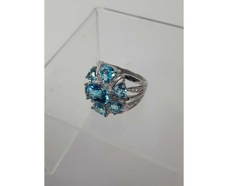TOPAZ PENDANT AND RING, each of starburst form and set with small diamond chips, each in fourteen carat white goldSize M