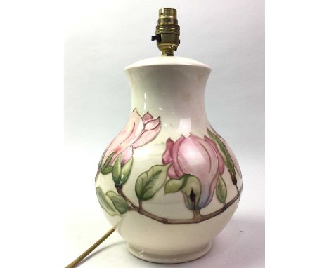 MODERN MOORCROFT TABLE LAMP, with tube lined floral decoration on a cream ground33cm high overall 