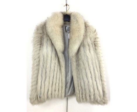 LADY'S FUR COAT, bearing label Saga FoxWe are unable to tell what fur the item is. There are no visible labels stating the si