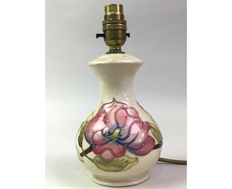 MODERN MOORCROFT TABLE LAMP, with tube lined floral decoration on a cream ground23cm high overall 