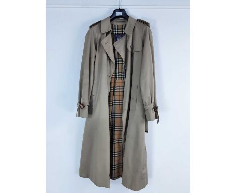 TWO TRENCH COATS, comprising a Burberry tan trench coat and a Four Seasons London trench coatQty: 2The Burberry jackets is fe