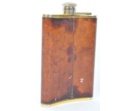 A vintage 20th century gold plated leather bound spirits flask having a screw top and makers mark to the base. 8oz capacity. 