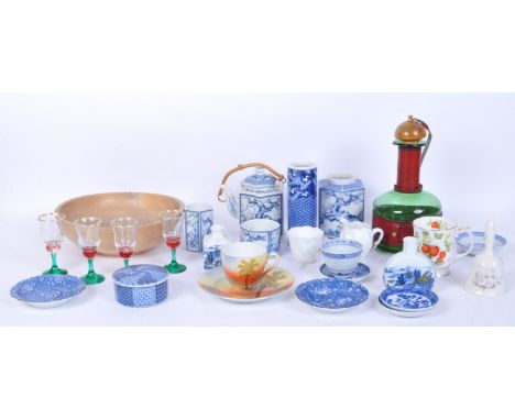 An assortment of 20th Century ceramic &amp; glass to include. A green glass belted decanter, blue and white Asian plates, vas