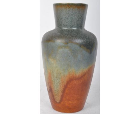 A vintage 20th Century West German lava pottery vase. With a rounded open top, tapering body with circular base in blue &amp;