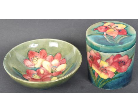 Two vintage 20th century Moorcroft green ground lidded pot &amp; bowl having the "Hibiscus" pattern. The lot to include a lid