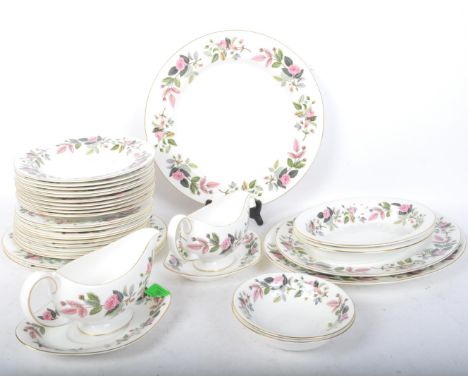 A collection of vintage 20th century Hathaway Rose China. The service comprising of plates, bowls, gravy boat and more. The c