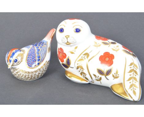 Two vintage 20th century Royal Crown Derby Imari pattern paperweights in the shape of a goldcrest &amp; a seal. The lot appea