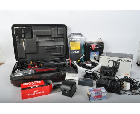 A vintage 20th century JVC VideoMovie VHSC movie camera within carry case. Accompanied by the relevant leads, an Osram Video 