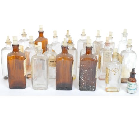 A collection of vintage 20th century medicine &amp; poison Apothecary / Chemists glass bottles coming in clear &amp; brown gl
