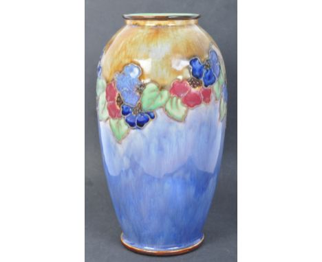 A vintage mid 20th century Royal Doulton stoneware drip glaze tube line vase of two tone colourway surrounding textured flowe